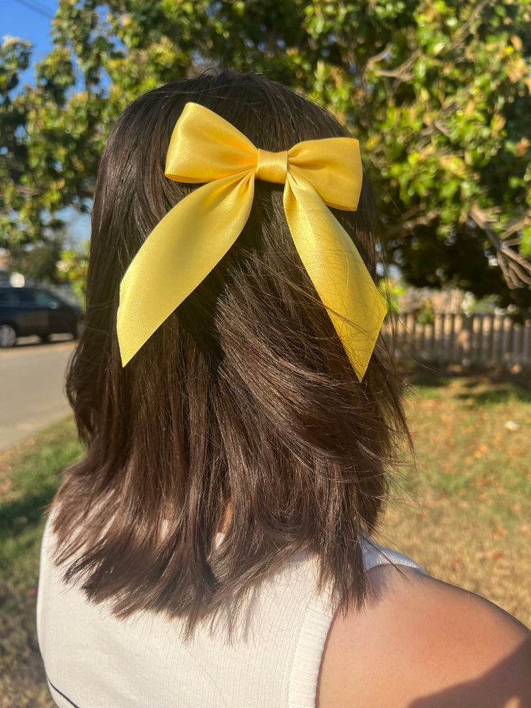 Woman wearing yellow Satin Small Hair Bow with Tails