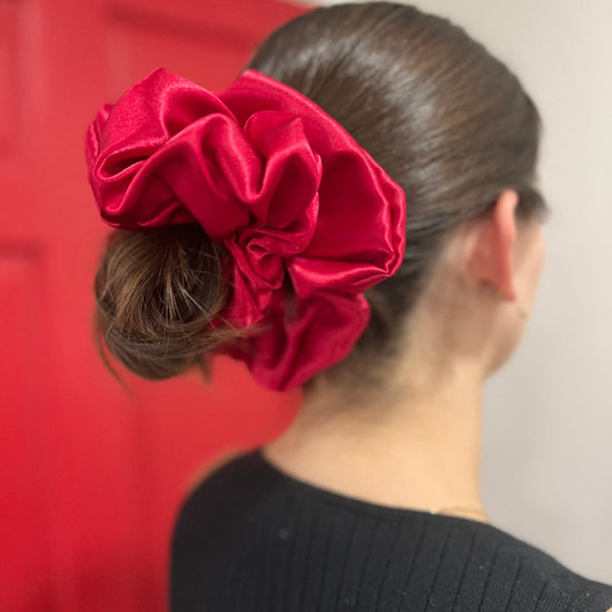 Woman wearing Ruby Jumbo Scrunchie