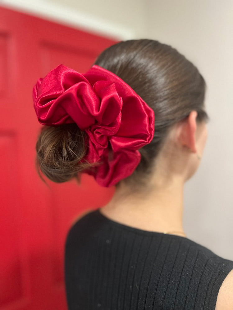 Woman wearing Ruby Jumbo Scrunchie