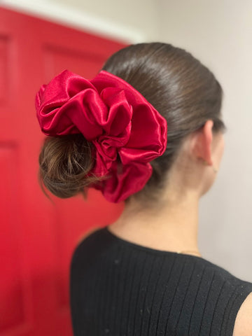 Woman wearing Ruby Jumbo Scrunchie