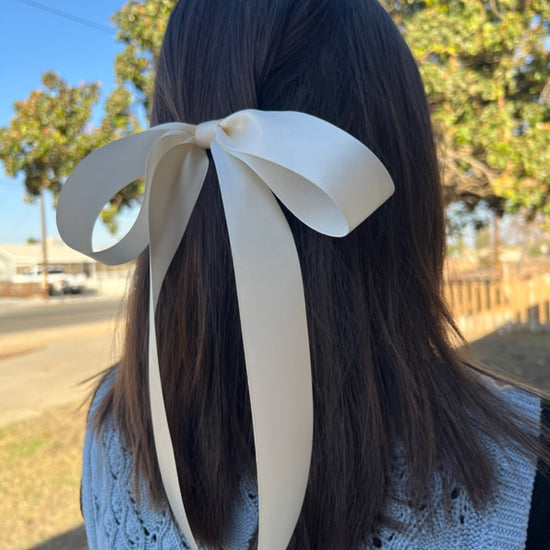 Girl wearing Lana Satin Double Droop Bow