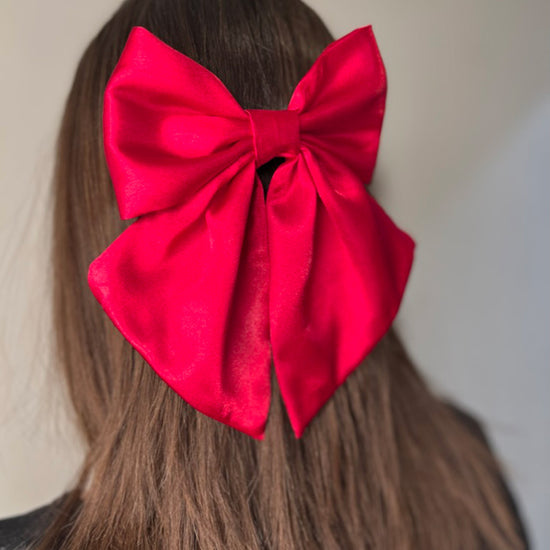 Girl wearing Ruby Satin Hair Bow