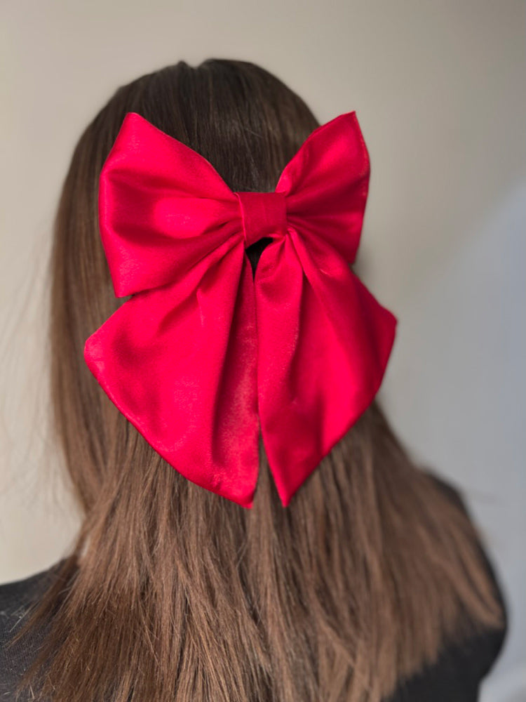 Girl wearing Ruby Satin Hair Bow