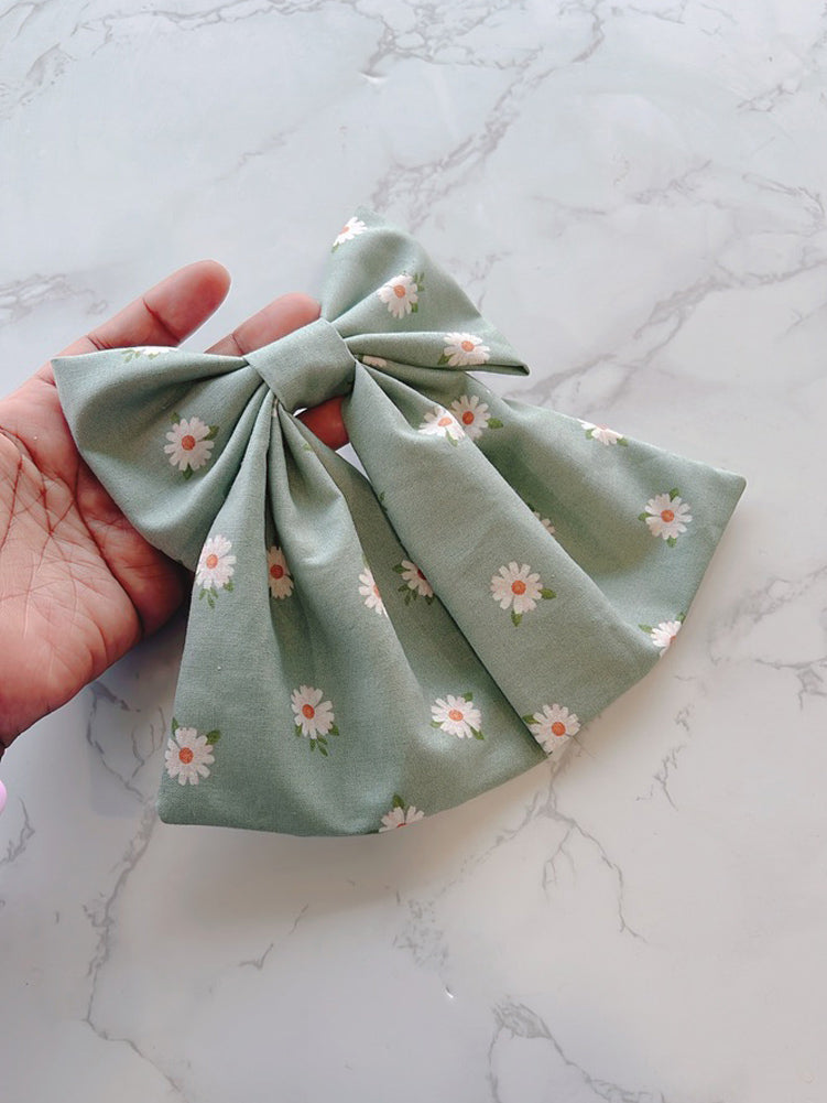 Hand holding Flower Garden Bow