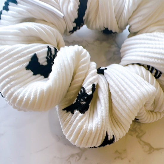 Handmade white ribbed scrunchie with black pattern