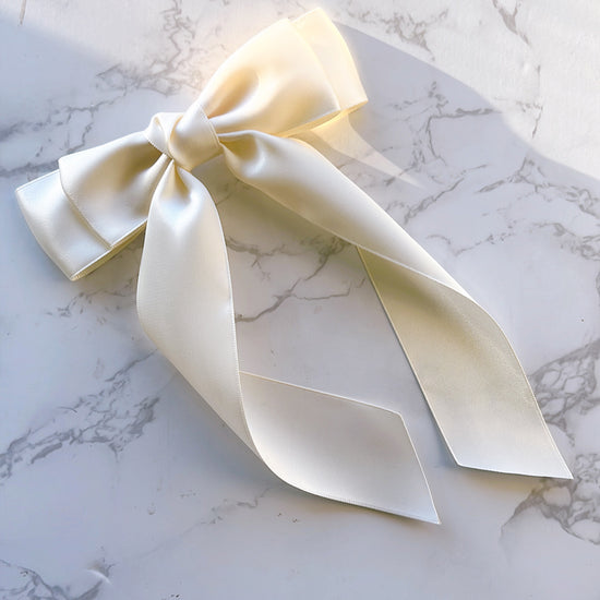 Handmade ivory satin ribbon bow with long tails