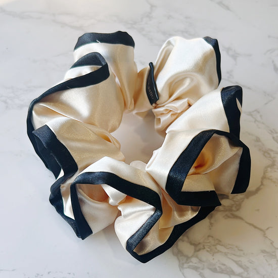 Cream satin scrunchie with black edges