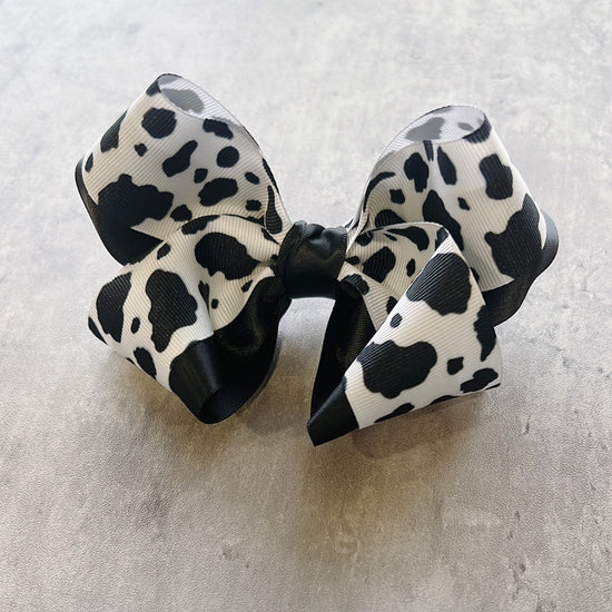 Black and white cow print hair bow