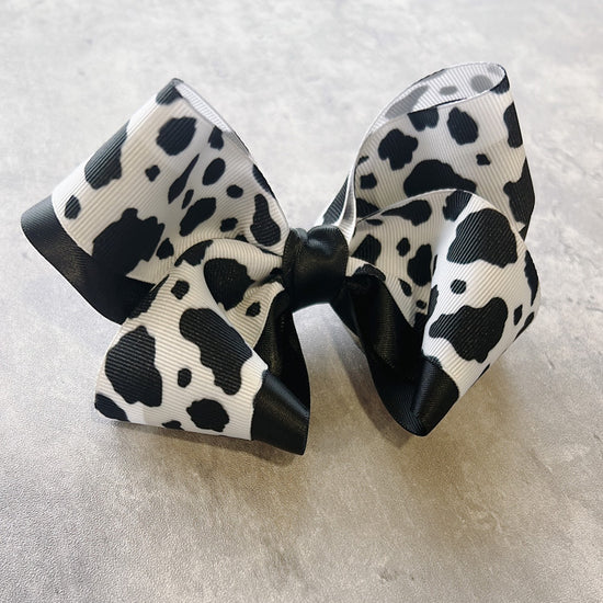 Black and white cow print hair bow