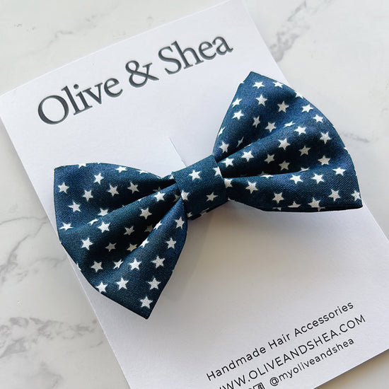 Navy blue bow with white star pattern