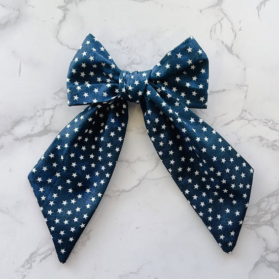 Blue bow tie with white star pattern