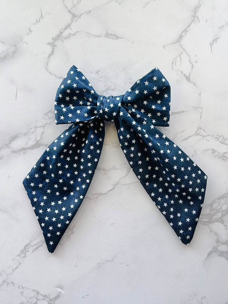 Blue bow tie with white star pattern