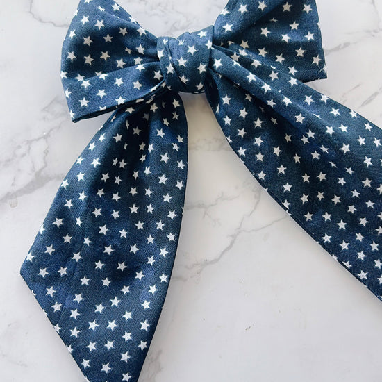 Blue bow tie with white star pattern 